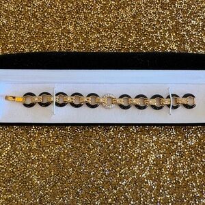 Gold and Black NWOT Link Bracelet with Crystal Accent. Comes in gift box.